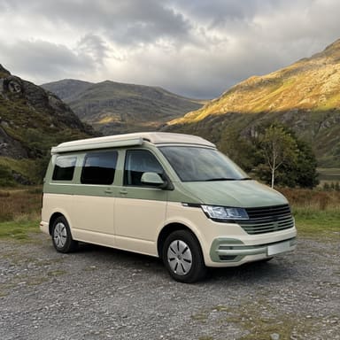 A camper van on a fell road.