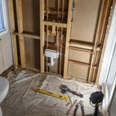 Copper pipework on stud walls before the bathroom is boarded.
